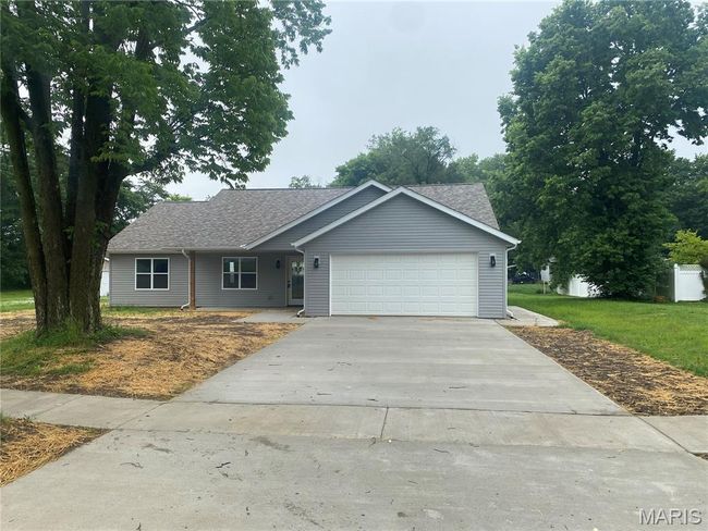Back of property with cooling unit, a yard, and roof with shingles | Image 33
