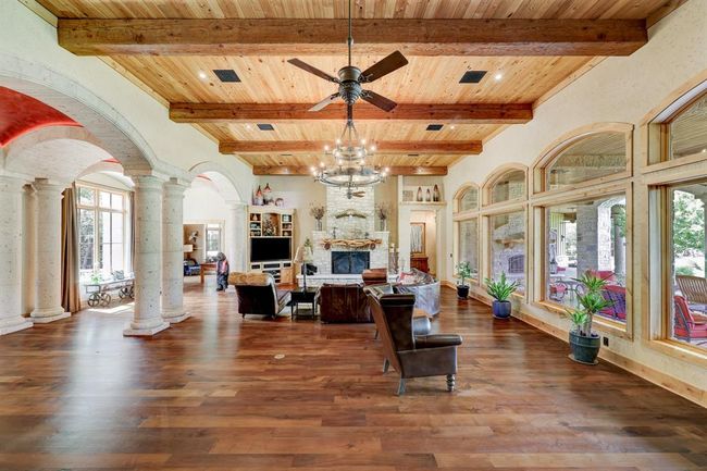 The beautiful open concept living room flows directly into the kitchen and foyer. | Image 12