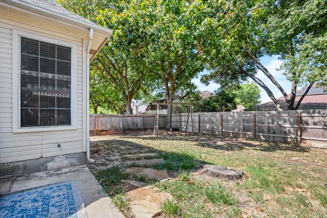View of fenced backyard | Image 28