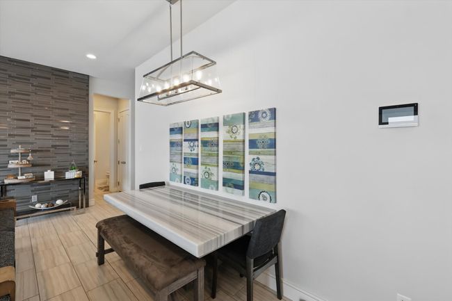 Dining area featuring recessed lighting, baseboards, and a chandelier | Image 21