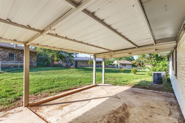 View of patio / terrace with a fenced backyard, a carport, and cooling unit | Image 23