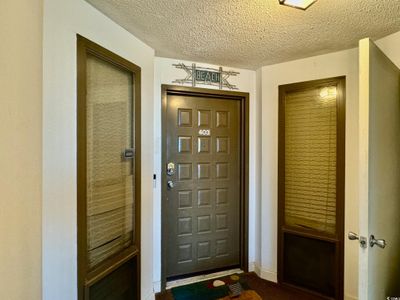 Foyer entrance featuring a textured ceiling | Image 2