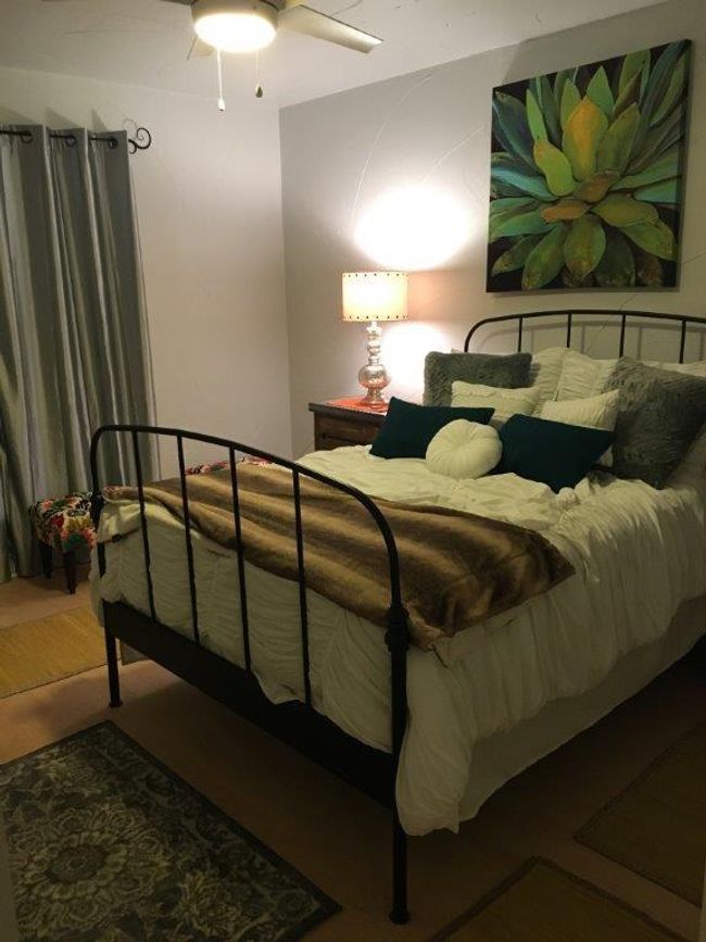 Bedroom with wood finished floors and ceiling fan | Image 6