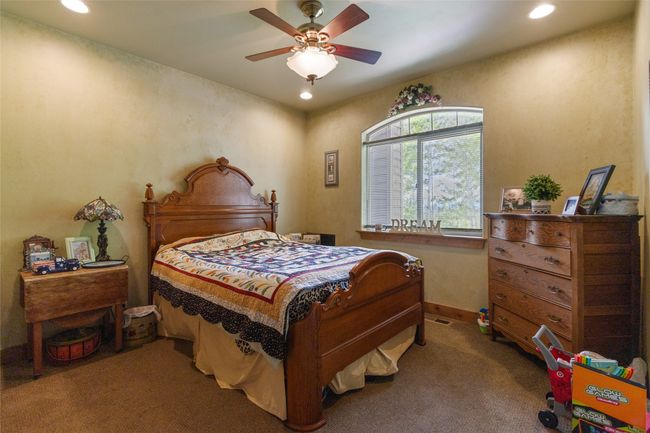 Bedroom with carpet flooring, recessed lighting, a ceiling fan, and baseboards | Image 23