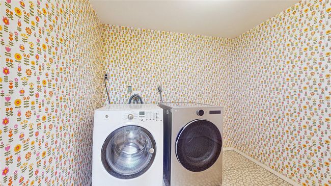 Washroom with tile patterned flooring, laundry area, and independent washer and dryer | Image 25