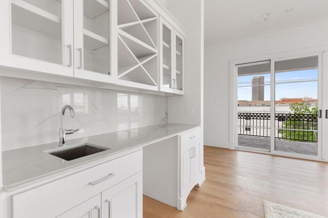 The rooftop level is equipped for entertaining with beverage storage, media wiring, and ample natural light. | Image 34