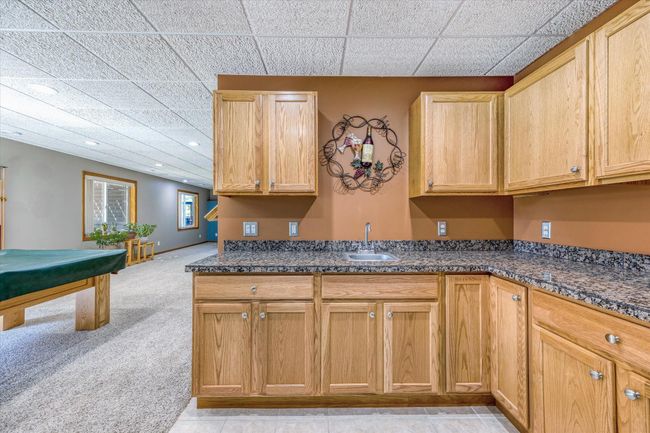 Corner wet bar, over looks billiards room and walk out door | Image 39