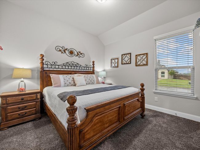 Bedroom featuring dark carpet and vaulted ceiling | Image 22