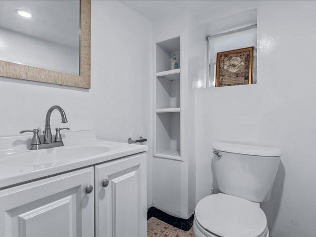 Bathroom featuring toilet, vanity, and built in shelves | Image 30