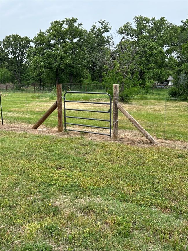 View of gate with fence and a yard | Image 16