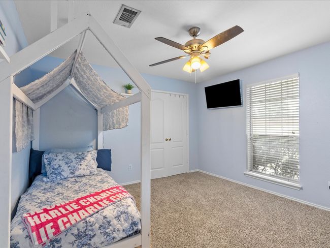 Carpeted bedroom featuring ceiling fan and baseboards | Image 27