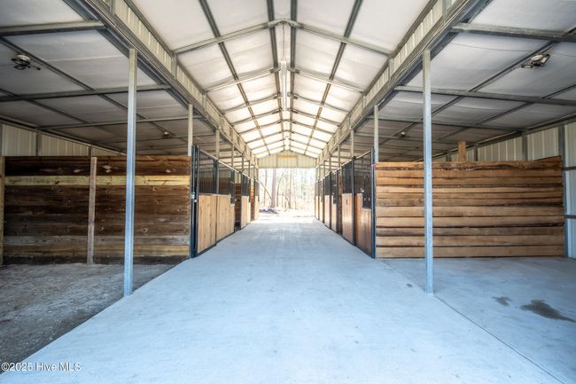 6-stall barn with a concrete a center aisle | Image 67