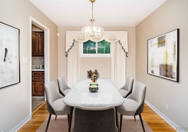 A virtually staged room provides a look into a furnished space... | Image 14