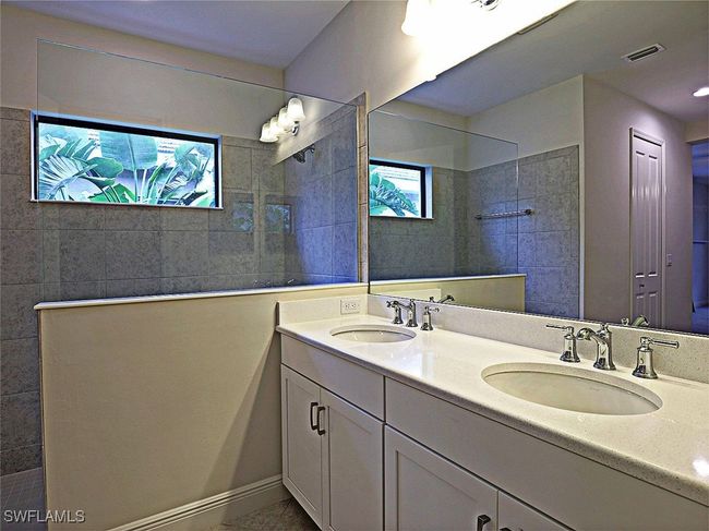 Full bathroom featuring walk in shower and double vanity | Image 16