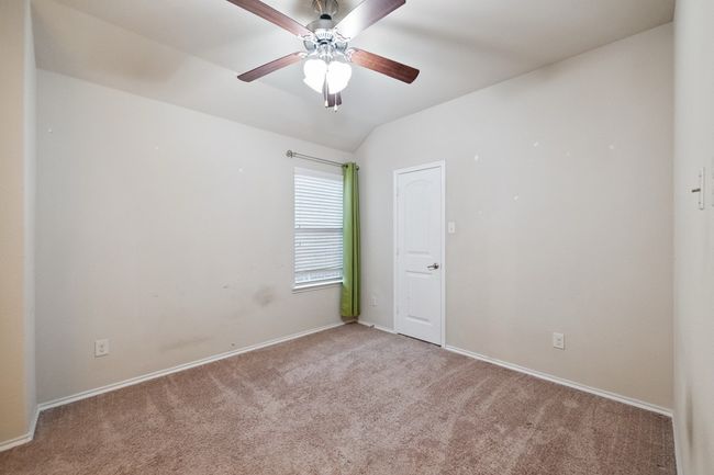 Empty room with light colored carpet and ceiling fan | Image 22