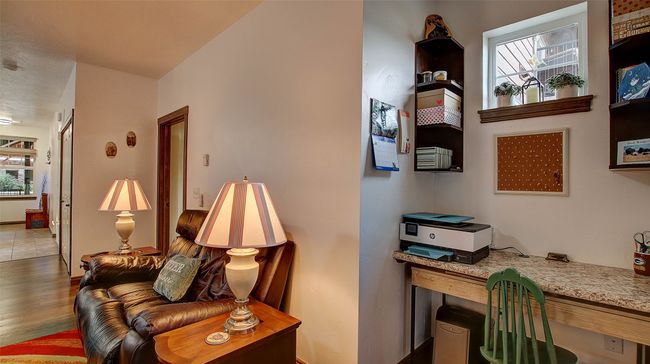 Built in desk located in the living room next to the sliding door, perfect for working from home | Image 20