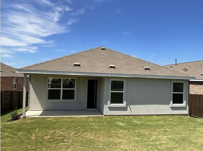 Rear view of house featuring a shingled roof, a patio area, and stucco siding | Image 27