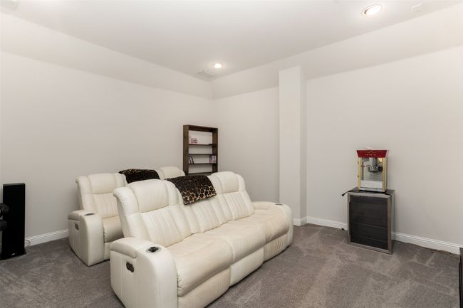 Living room featuring recessed lighting, baseboards, and carpet | Image 27