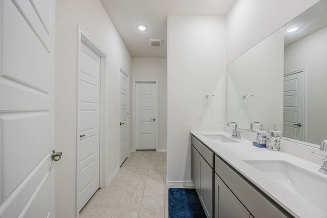 Full bathroom featuring double vanity, recessed lighting, and tile patterned flooring | Image 25