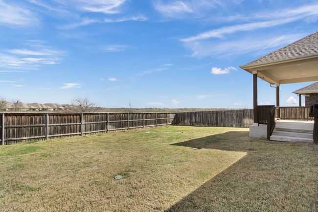 View of yard with a fenced backyard | Image 29