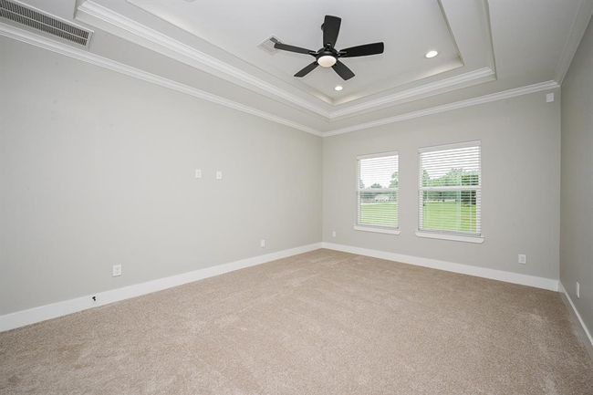 Lots Of Natural Light Coming From Outside In The Spacious Primary Bedroom | Image 24