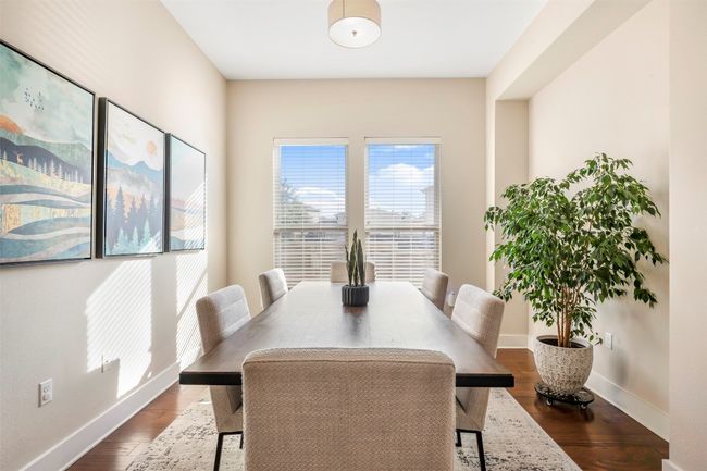 Dining room with wood finished floors | Image 13