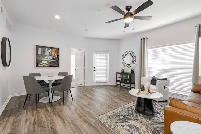 Living room featuring hardwood / wood-style flooring and ceiling fan | Image 4