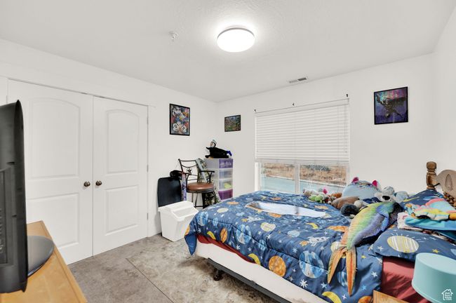 Bedroom featuring carpet floors and a closet | Image 11