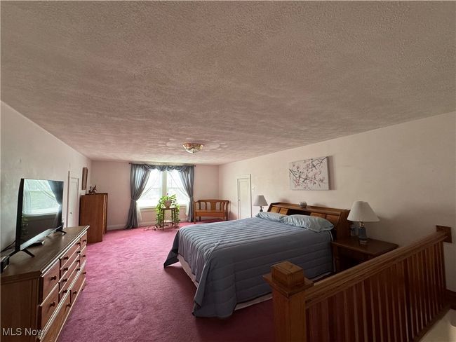 2nd floor Bedroom featuring a textured ceiling and carpet | Image 27