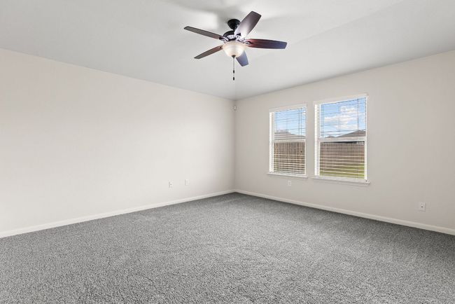 Spare room featuring ceiling fan, baseboards, and carpet floors | Image 24