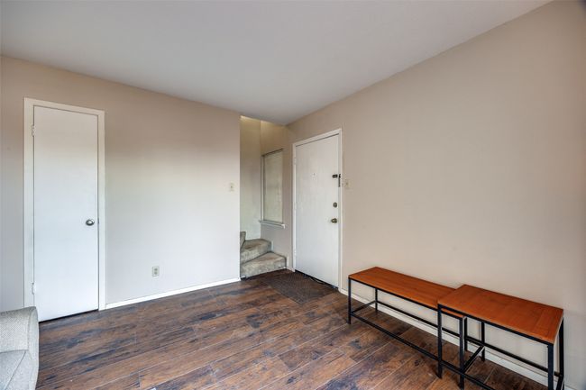 front door leading to stairs and storage closet | Image 17