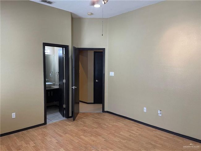 Empty room with light wood-type flooring and baseboards | Image 22