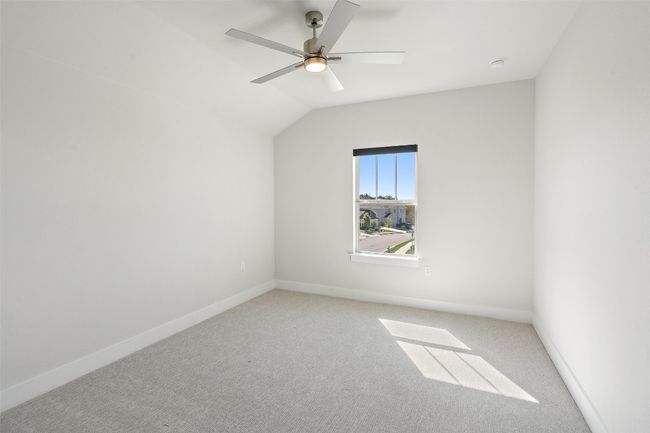 Bonus room with light carpet, ceiling fan, and lofted ceiling | Image 30
