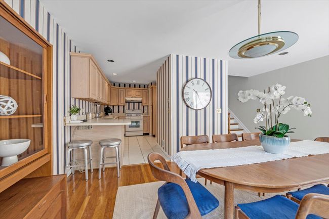 Dining area featuring stairway, light wood-style flooring, and recessed lighting | Image 7