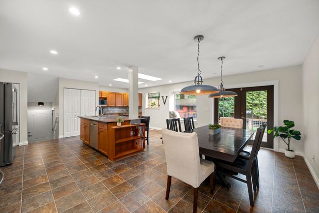 Dining area featuring baseboards, stone finish flooring, and recessed lighting | Image 17