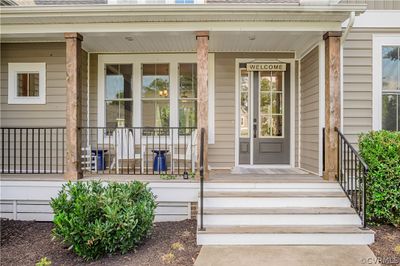 Inviting front porch with wood columns. | Image 2