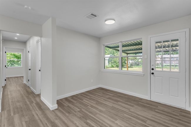 Entryway with light wood-style floors and baseboards | Image 5