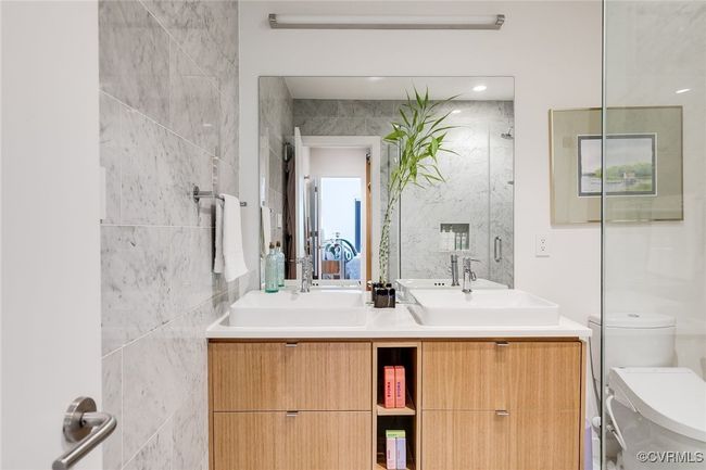 Scandinavian style double vanity with quartz counters. | Image 34