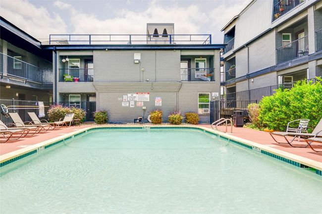 Community pool with a patio | Image 5