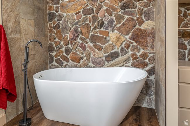 Full bathroom with a freestanding bath and wood finished floors | Image 32
