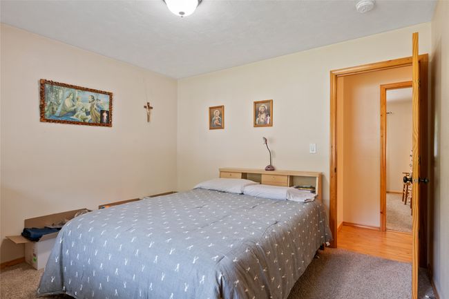 Bedroom featuring carpet flooring and baseboards | Image 35