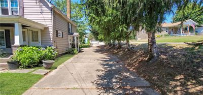 View of side of home with a lawn | Image 3