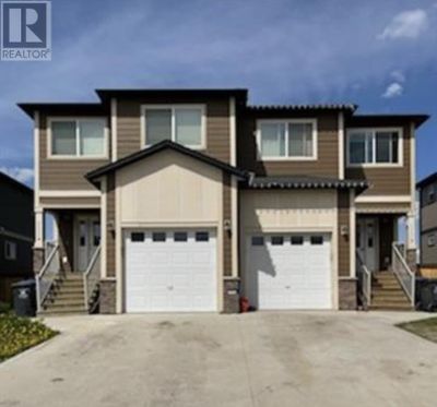 11112 104a Ave, Home with 5 bedrooms, 4 bathrooms and null parking in Fort St. John BC | Image 1