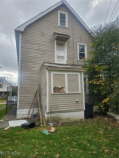 View of side of home featuring a lawn | Image 2