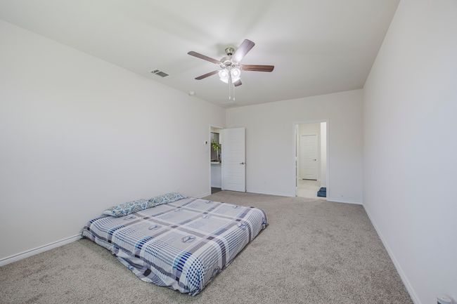 Bedroom featuring carpet floors and ceiling fan | Image 14