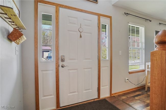 Entrance foyer with dark wood-type flooring and baseboards | Image 4