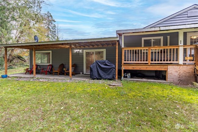 Back of home with patio and deck off primary bedroom | Image 27