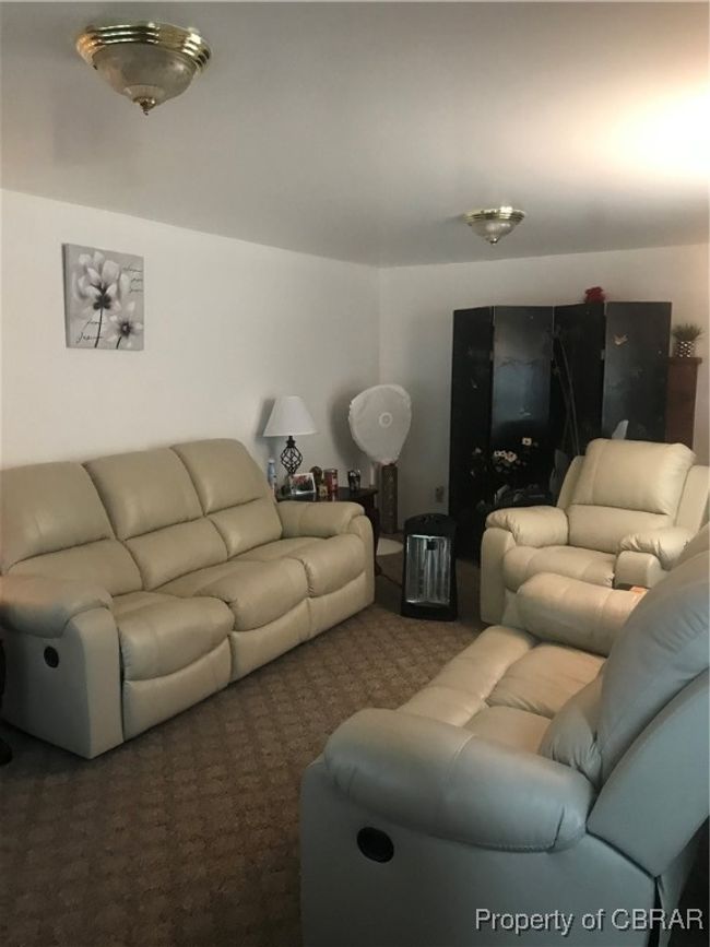 Living room with dark carpet | Image 4