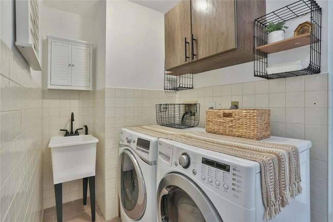 The laundry is right off the kitchen, making for efficient multitasking when you're in the mood. And you don't know how great it is to have a slop sink until you have one. | Image 15