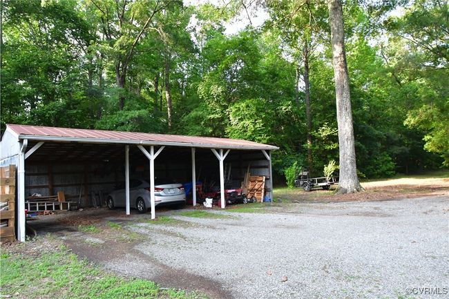 A 3 bay carport for all your vehicle needs! | Image 38